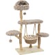 Arbre à chat beige en peluche avec plusieurs plateformes, un jouet pompon suspendu et un hamac tissé sur une base en bois.