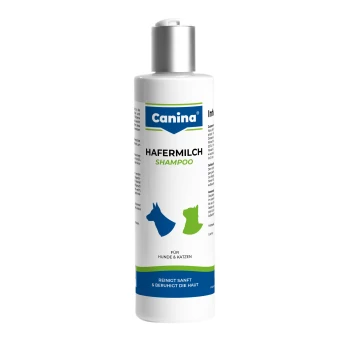 Weiße Flasche mit der Aufschrift Canina HAFERMILCH SHAMPOO für Hunde & Katzen, blaue und grüne Hunde- und Katzen-Icons, Text: Reinigt sanft & beruhigt die Haut