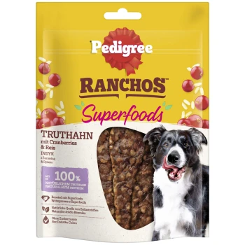 Verpackung von Pedigree Ranchos Superfoods Hundeleckerlis mit einem Border Collie, mit Text, der Zutaten wie Truthahn, Cranberries und Reis hervorhebt.