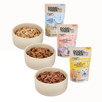 Buntes "Schlemmerbox" Hundefutter von Dogs'n Tiger, mit vier Geschmacksrichtungen: "Schabernack", "Firlefanz", "Klimim" und "Allerlei."