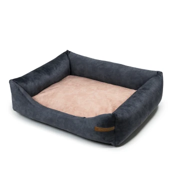 Ein plüschiges Haustierbett mit einem dunkelgrauen Äußeren und einem weichen rosa Inneren, mit erhöhten Seiten für Komfort und Unterstützung.