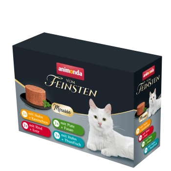 vom Feinsten Adult Mousse-Vielfalt 12x85 g Animonda Katzenfutterverpackung mit Mousse-Geschmäckern: Huhn & Kaninchen, Truthahn & Fasan, Rind & Ente, Huhn & Thunfisch. Eine weiße Katze ist daneben.