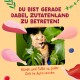 Oranger getigerter Kater lugt durch Monstera-Blätter zwischen illustriertem Fleisch; deutscher Text über das Betreten von 'Zutatenland'
