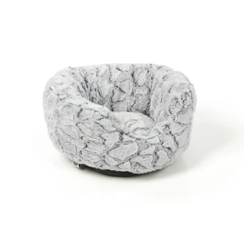 Weiches, rundes graues Hundebett mit plüschiger Textur, mit einem gemütlichen, gepolsterten Inneren.