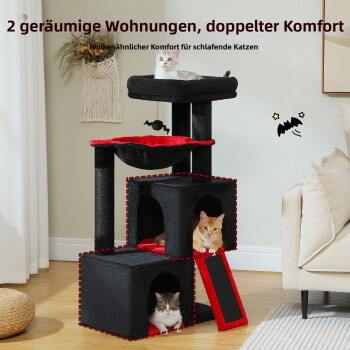 Katze mit Hexenhut liegt in einer rot-schwarzen supergroßen Hängematte mit Fledermaus-Pompon-Spielzeug, 40 cm/15,7" breit.