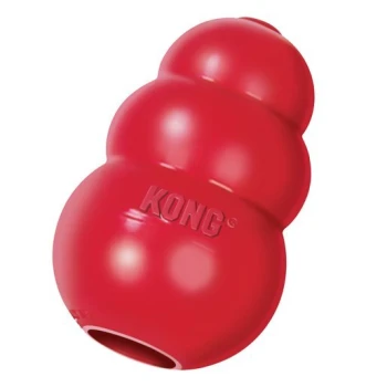 Red KONG dog toy, shaped like a snowman with a hollow center for treats, featuring the brand name "KONG" embossed on the side.