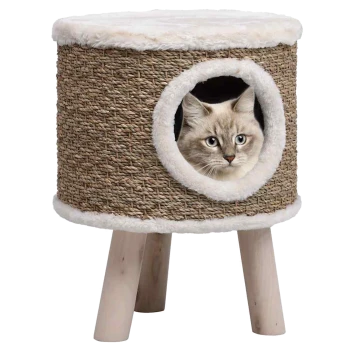 Ein gemütliches Katzenhaus aus geflochtenem Material mit einem plüschigen Oberteil und einem runden Eingang, mit einem flauschigen weißen Rand und einer Katze, die herausblickt.