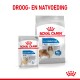 Royal Canin Light Weight Care hondenvoer verpakking, met een klein 85g zakje en een grotere zak, met een hondenafbeelding en voedingsclaims.