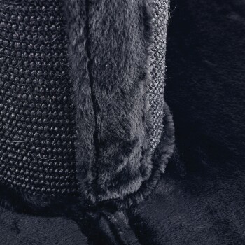 Nahaufnahme eines weichen, schwarzen Haustierbettes mit einem plüschigen, pelzigen Rand und einer gewebten Textur, ideal für den Komfort von Haustieren.