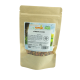 Braune Papiertüte mit Kürbisflocken für Haustiere, beschriftet mit "Kürbisflocken", mit dem Hinweis, dass sie 100% frisch und für kleine Tiere geeignet sind.