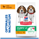 Hill's Welpenfutterbeutel mit zwei Welpen — „PUPPY <1 MEDIUM“, „mit Huhn“, „5 essentielle Vorteile“, „OPTIMALES WACHSTUM“