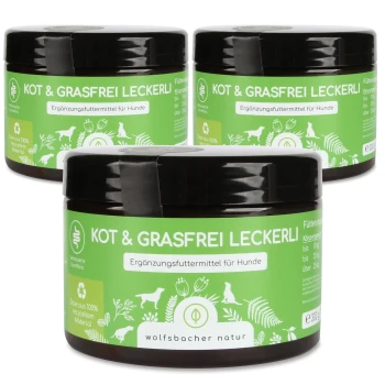 Drei Gläser "Kot & Grasfrei Leckerli", ein Hundesupplement, mit grünen Etiketten, die Nährwertinformationen und die Marke "wolfsbacher natur" zeigen.