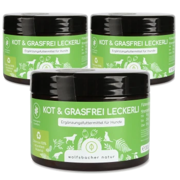 Drei Gläser "Kot & Grasfrei Leckerli", ein Hundesupplement, mit grünen Etiketten, die Nährwertinformationen und die Marke "wolfsbacher natur" zeigen.