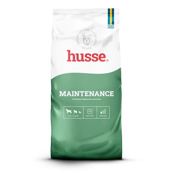 Eine Tüte Husse Hundefutter mit der Aufschrift "Mild", die ein glutenfreies Rezept mit Huhn und Forelle enthält und die optimale Darmgesundheit fördert.