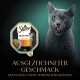 Verpackung von Sheba Selection Katzenfutter mit einem Gericht aus Fleisch in Sauce, mit Text, der seinen unwiderstehlichen Geschmack für Katzen bewirbt.
