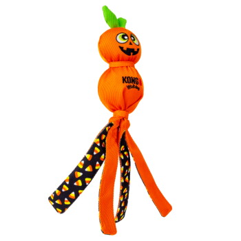 Orange KONG Wubba pumpkin dog toy with jack-o'-lantern face, green leaf top and candy-corn patterned fabric tails