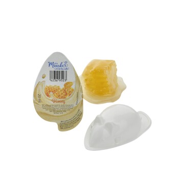 Honigleckerei für Katzen in einem verspielten, mausförmigen Behälter, mit einem Stück Wabenhonig und einem Etikett mit der Aufschrift "20ml Honig."