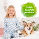 Lächelndes blondes Mädchen im Wolken-Schlafanzug auf dem Bett mit einem Corgi; grüne Sprechblase mit der Aufschrift “Endlich dauerhaft geruchsfrei”.