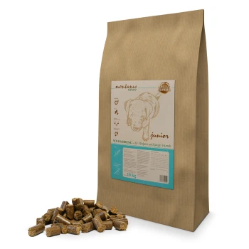 Braune Papiertüte mit Hundefutter, beschriftet mit 'montanus nature junior', mit einer Illustration eines Welpen, enthält 10 kg vollständige Ernährung für Welpen.