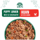 Schüssel mit Welpenfutter mit Huhn, Reis und Gemüse, beschriftet mit „Puppy Junior bis 12 Monate Huhn mit Reis & Gemüse“.