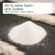 Ein Haufen weißes Pulver mit der Aufschrift "100 % reines Taurin - ohne Zusätze" auf einer dunklen Oberfläche.