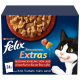 Une boîte de nourriture pour chats Purina Felix Sensations Extras avec de la nourriture humide, mettant en vedette un chat noir et blanc joueur et un texte allemand sur les saveurs.