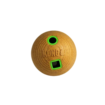 KONG dog toy, round shape with a textured surface, featuring a yellow-brown color and green openings for treats.