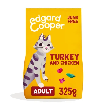 Yellow cat food bag featuring a playful illustrated cat, labeled "Turkey and Chicken," "Adult," and "325g," with "Junk Free" prominently displayed.