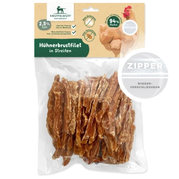 Getrocknete Hühnerbruststreifen in einem wiederverschließbaren Beutel, mit der Aufschrift 'Hühnerbrustfilet in Streifen', mit 2,5% Fett und 94% Hühneranteil.