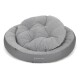 Graues Hundebett mit einem plüschigen, gepolsterten Design, mit kreisförmiger Form und dem Logo "Doctor Bark" an der Seite.