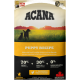 ACANA Puppy Recipe Hundefutterbeutel mit zwei Hunden auf einem Feld, der frisches kanadisches Huhn, rohe Flunder und 70 % hochwertige tierische Zutaten hervorhebt.