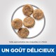 Image de cinq morceaux ronds de croquettes pour animaux, avec un texte superposé indiquant 'UN GOÛT DÉLICIEUX' et 'Taille approximative des croquettes 4 x 7,5 mm'.