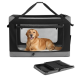 Schwarz-graue weiche Tiertransporttasche mit Netzfront, in der ein liegender Golden Retriever liegt; gefaltete Tasche darunter.