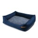 Marineblaues Haustierbett mit erhöhten Seiten und einem weichen grauen Zentrum, mit einem kleinen braunen Etikett an der Seite.