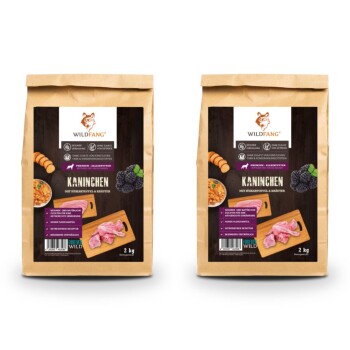 Zwei Beutel WILDFANG Premium-Hundefutter mit der Aufschrift 'KANINCHEN mit Süßkartoffel & Kräuter', jeweils 2 kg schwer, mit Bildern der Zutaten.