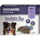 A protein bar package for dogs featuring a smiling dog, with text stating "PREMIERE I ❤️ my dog Protein Bar" and "69% Lamb with blueberries."