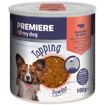 Eine Dose PREMIERE Hundefutter-Topping-Pulver mit einem lächelnden Hund auf dem Etikett. Das Produkt ist Rinderleber mit Kürbis, 100g.