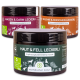 Drei Gläser mit Hundesupplementen, beschriftet mit "Magen & Darm Leckerli," "Gelenke & Knochen Leckerli," und "Haut & Fell Leckerli," mit Nährwertdetails.