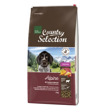Hundefutterbeutel "Real Nature Country Selection - Alpine" mit einem Hund in den Bergen, der Truthahn, alpines Rindfleisch, Käse und Kürbis enthält. 12 kg.