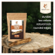 Verpackung des Wildfang Olive Wood Kausticks auf Holz, die Haltbarkeit, niedrige Kalorien, natürliche Rinde und abgerundete Kanten zeigt.