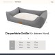 Graues Hundebett mit einem cremefarbenen Kissen, beschriftet mit Abmessungen für die Größen M, L und XXL, und dem Text "Die perfekte Größe für deinen Hund."