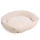 Ein plüschiges, rundes Haustierbett mit einer weichen, gerippten Textur in einer hellbeigen Farbe, entworfen für Komfort und Entspannung.