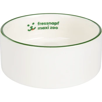 Bol pour animaux de compagnie en céramique blanche avec un bord vert, portant le texte "fressnapf maxi zoo" et un graphique de chien ludique.