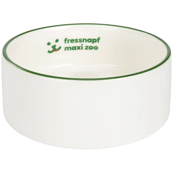 White ceramic pet bowl with a green rim, featuring the text "fressnapf maxi zoo" and a playful dog graphic.