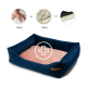 Navyblaue Plüsch-Hundebett mit weichem rosa Innenraum, Pluszeichen-Grafik und Handabdruck-Illustrationen für Komfortschichten.