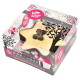 Dog-shaped celebration cake in clear box from The Barking Bakery, paw-print graphics and "Handmade in the UK" label.