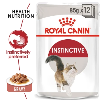 Royal Canin Instinctive cat food pouch, 85g x 12, featuring a fluffy cat and a bowl of gravy-covered kibble, labeled "Instinctively preferred."