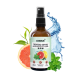 Zahnpflegespray-Flasche mit dem Etikett 'noms+' mit einer Grapefruitscheibe, Minzblättern und einem Wasserspritzer, der die Zahngesundheit für Haustiere fördert.