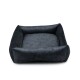 Ein plüschiges, dunkelgraues Haustierbett mit erhöhten Rändern und einem weichen Innenraum, entworfen für Komfort und Unterstützung für Haustiere.