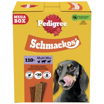 Boîte jaune Pedigree Schmackos Mega Box friandises pour chiens 110x Multi Mix, teckel se léchant les lèvres et bâtonnets de friandise en photo.